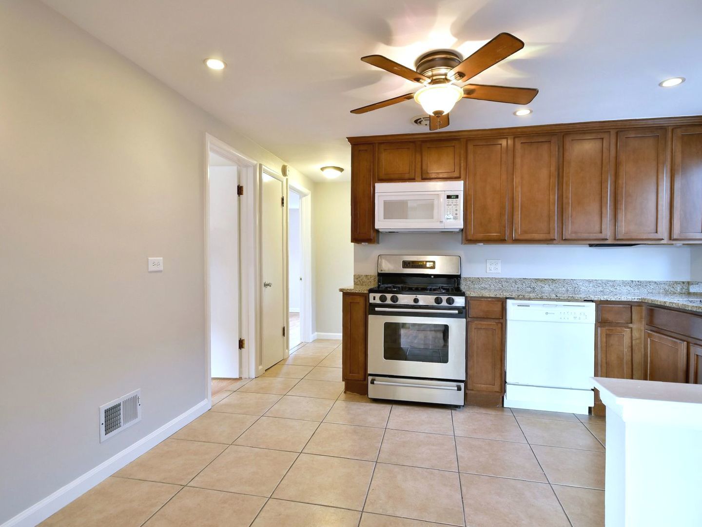 5220 South Rutherford Avenue Chicago, IL 60638 - Photo 6 of 18 a kitchen with stainless steel appliances a stove and a refrigerator