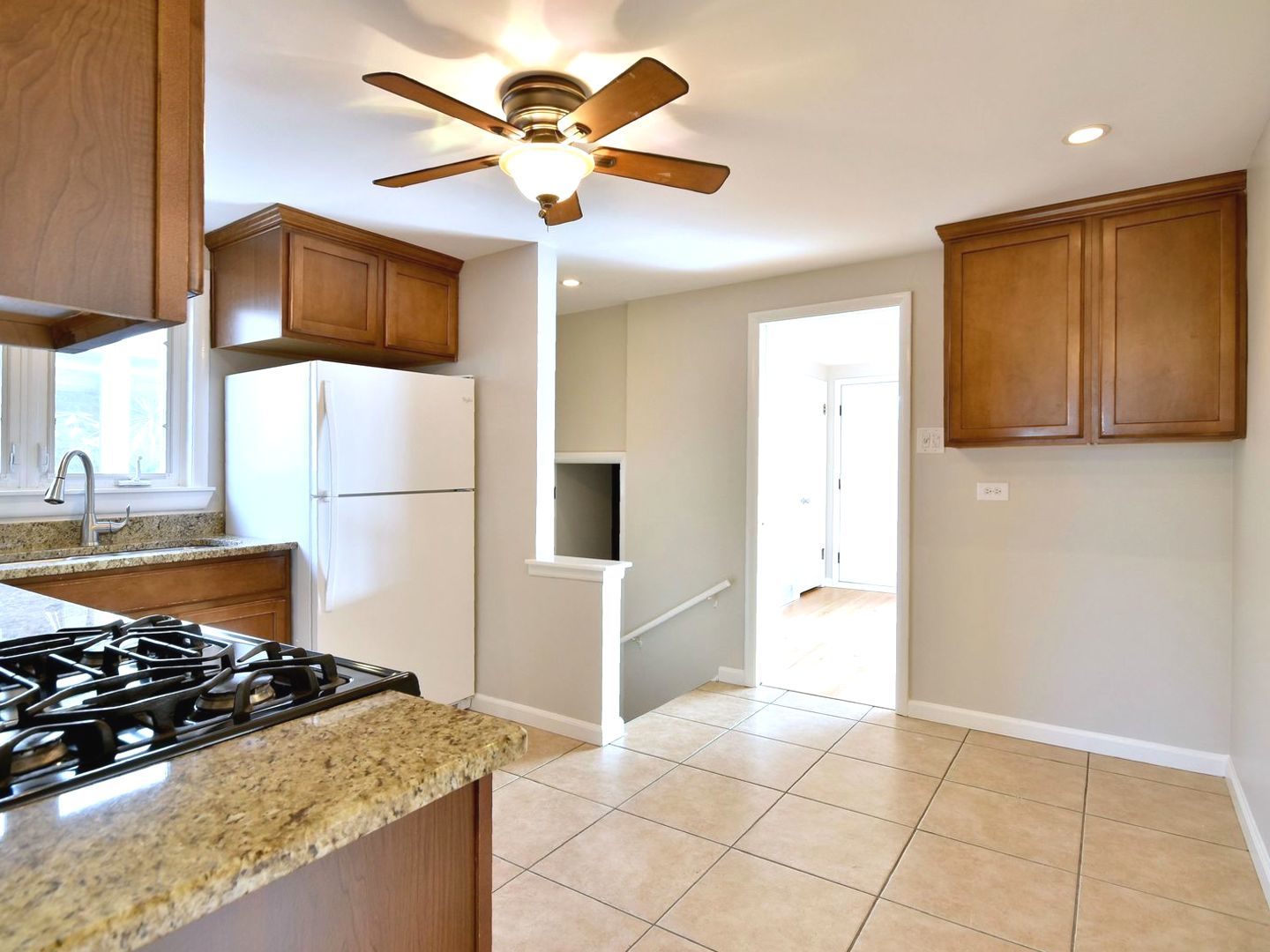 5220 South Rutherford Avenue Chicago, IL 60638 - Photo 9 of 18 a kitchen with stainless steel appliances granite countertop a refrigerator a stove and a sink with granite countertops