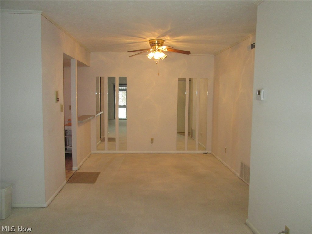 22958 Maple Ridge Road, Unit 208 North Olmsted, OH 44070 - Photo 35 of 35 Dining room with a ceiling fan and the dining room can be viewed from the kitchen and living room, a nice open floor plan.