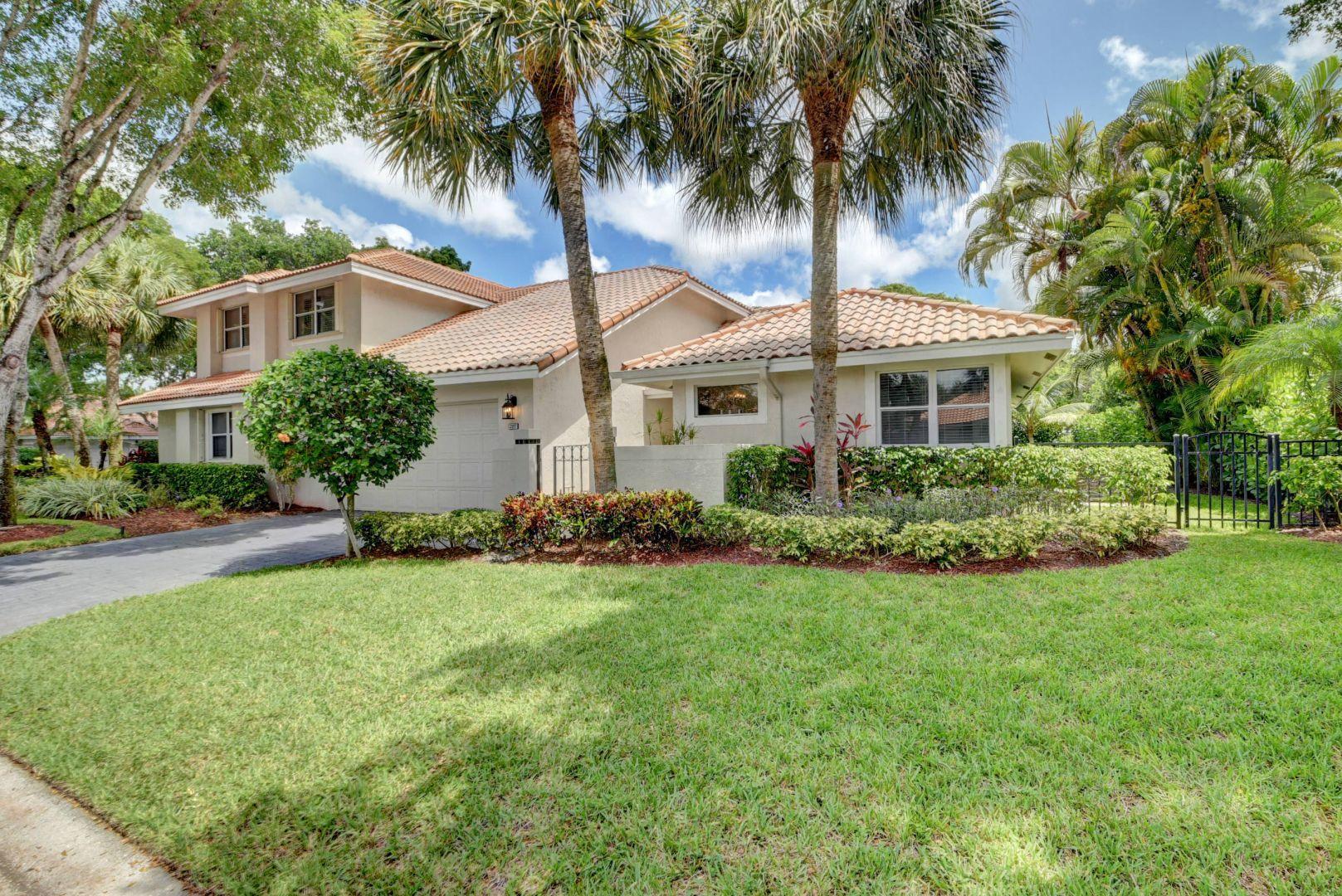 2157 Northwest 52nd Street Boca Raton, FL 33496 - Photo 1 of 27 front view of a house with a yard