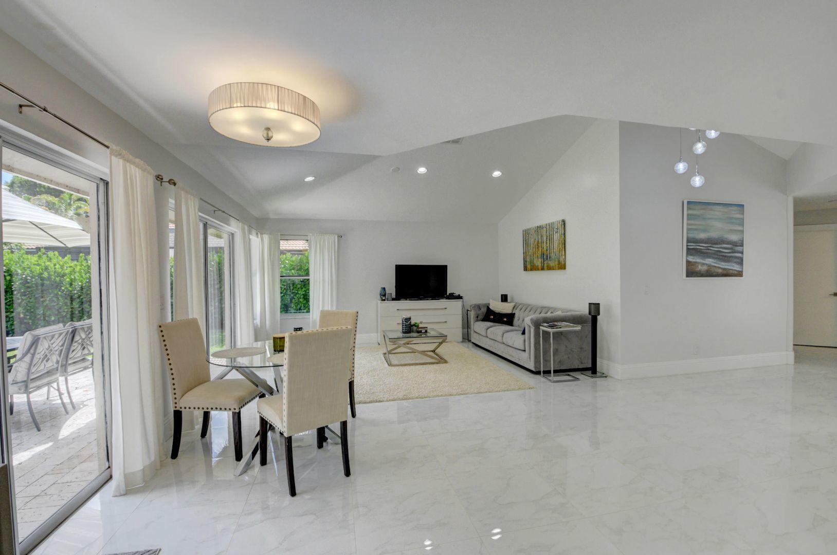2157 Northwest 52nd Street Boca Raton, FL 33496 - Photo 14 of 27 a living room with furniture and a large window