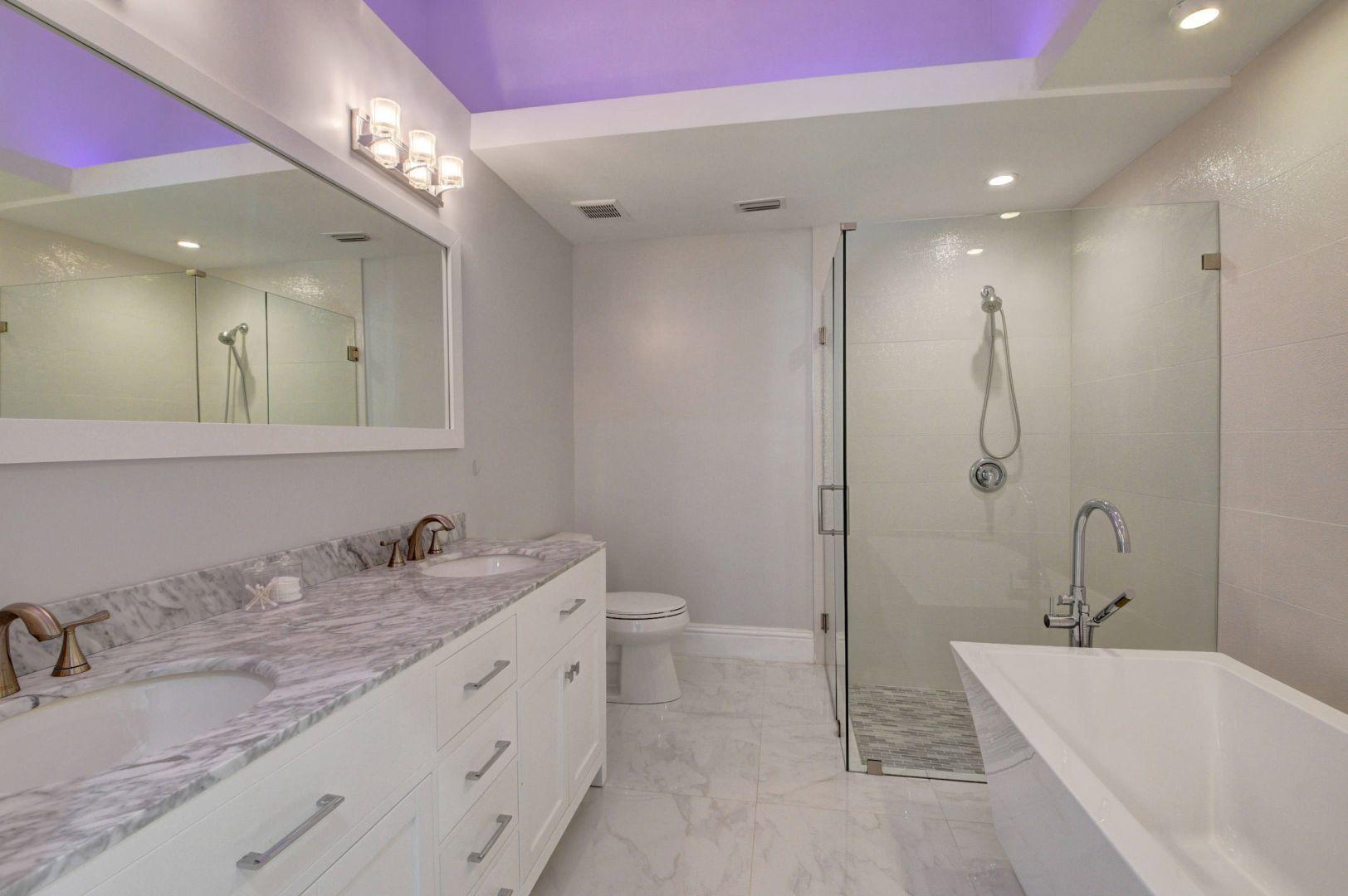 2157 Northwest 52nd Street Boca Raton, FL 33496 - Photo 17 of 27 a bathroom with a granite countertop sink mirror and bathtub