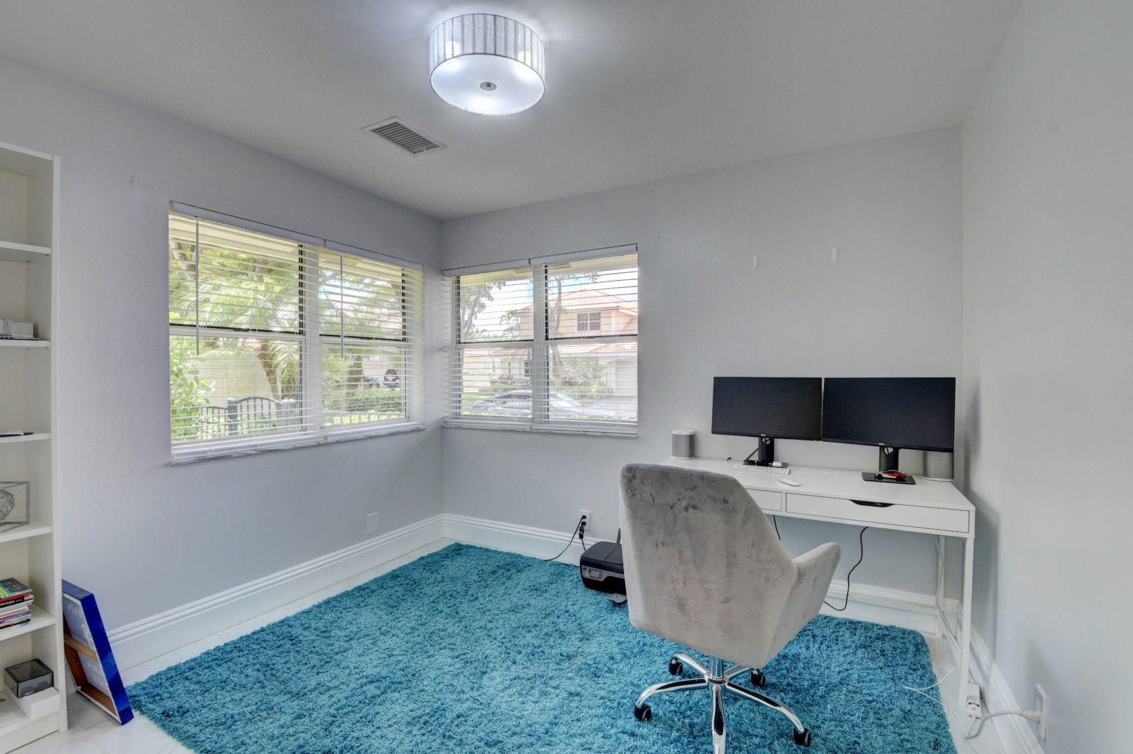 2157 Northwest 52nd Street Boca Raton, FL 33496 - Photo 21 of 27 a view of a workspace with furniture and a window