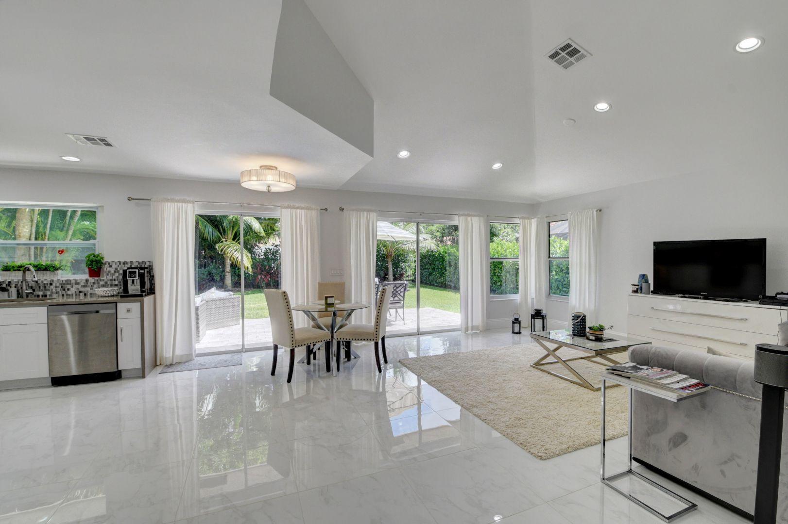 2157 Northwest 52nd Street Boca Raton, FL 33496 - Photo 5 of 27 a living room with furniture and a flat screen tv