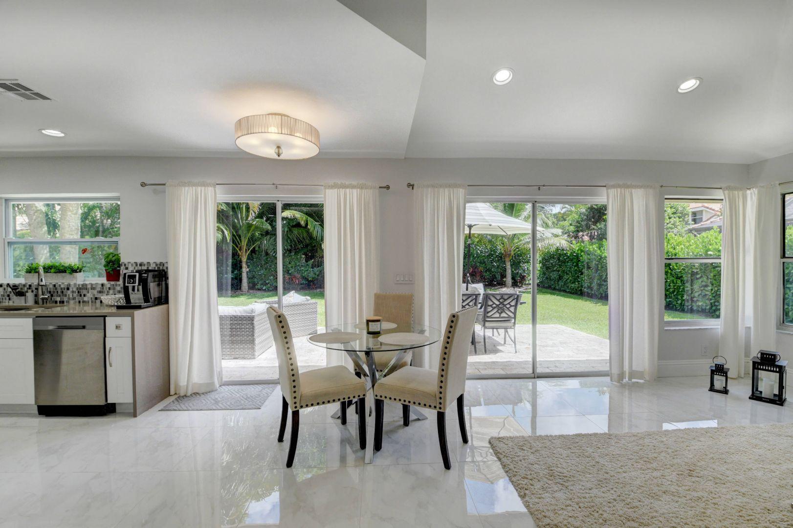 2157 Northwest 52nd Street Boca Raton, FL 33496 - Photo 9 of 27 a view of a dining room with furniture window and outside view