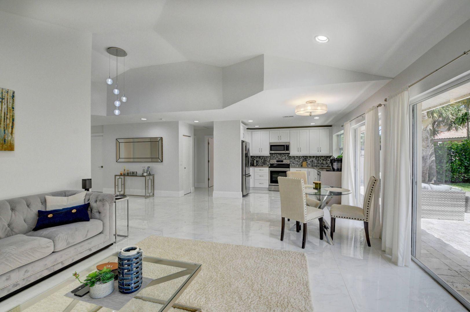 2157 Northwest 52nd Street Boca Raton, FL 33496 - Photo 10 of 27 a living room with furniture and view of kitchen