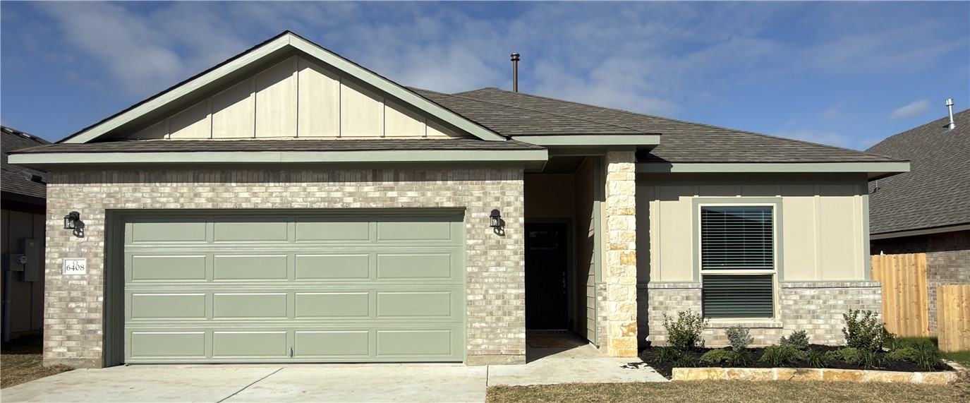 a front view of a house with a garage