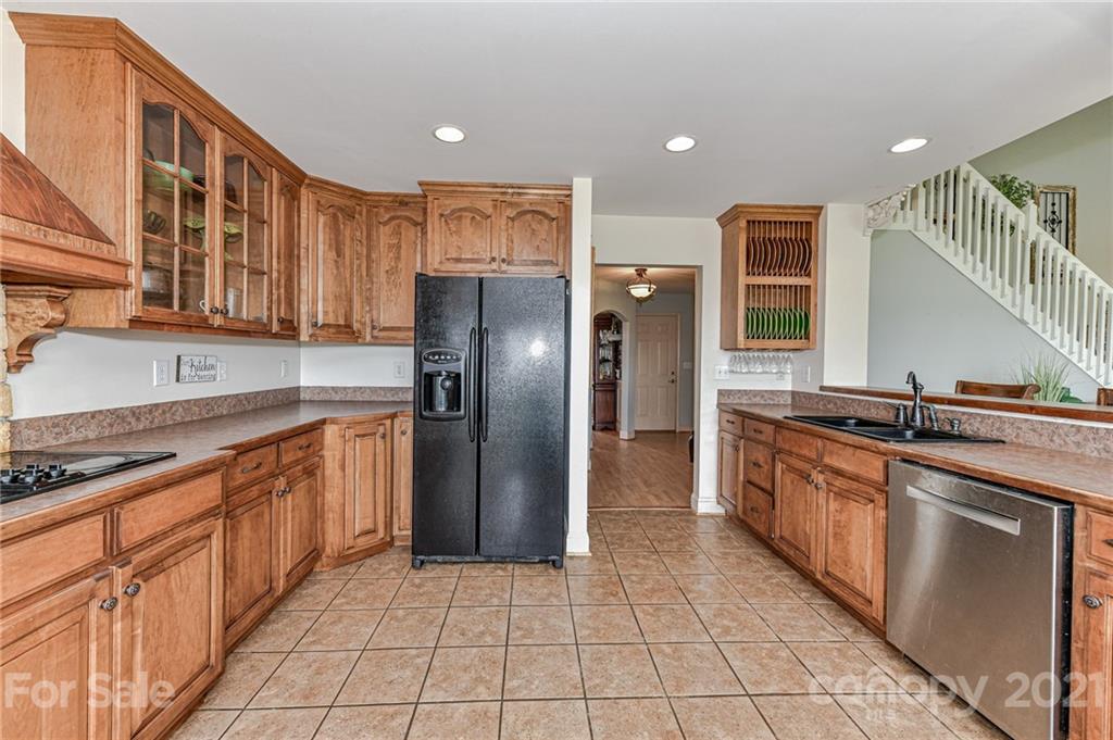 350 Curlee Road Polkton, NC 28135 - Photo 12 of 44 a kitchen with stainless steel appliances granite countertop a refrigerator and a sink