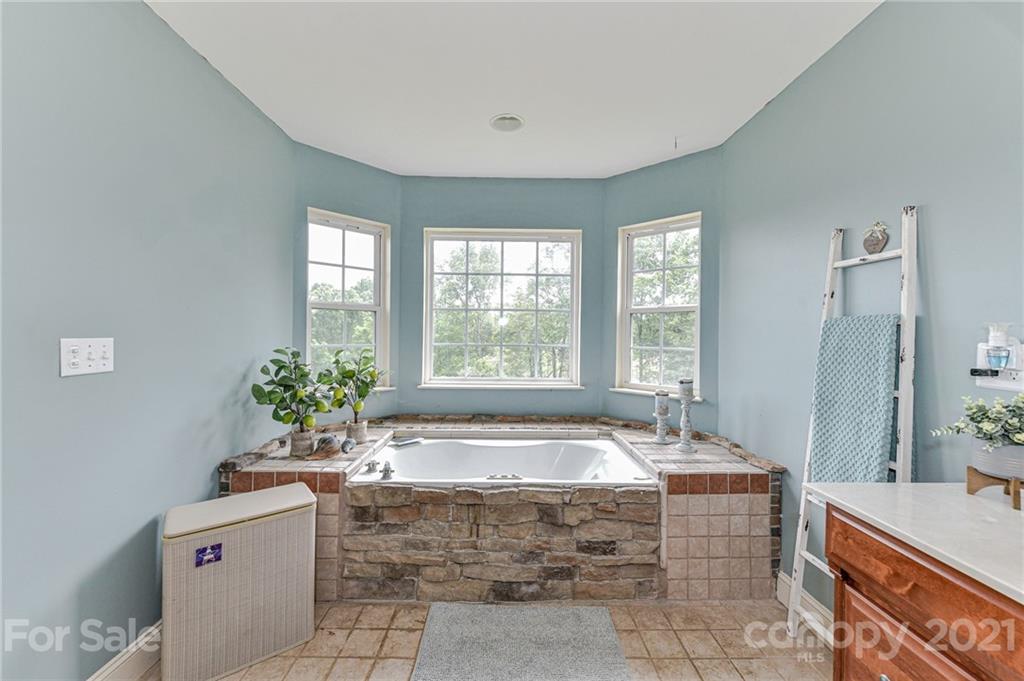 350 Curlee Road Polkton, NC 28135 - Photo 18 of 44 a spacious bathroom with sink shower and bathtub