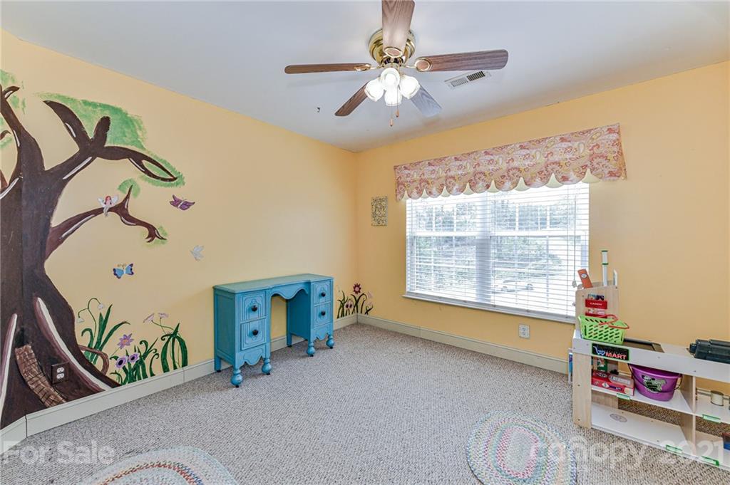 350 Curlee Road Polkton, NC 28135 - Photo 26 of 44 a room with toys and a chandelier