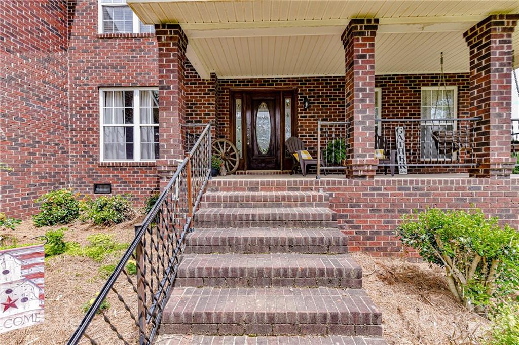 350 Curlee Road Polkton, NC 28135 - Photo 4 of 44 a front view of a house with a garden and plants