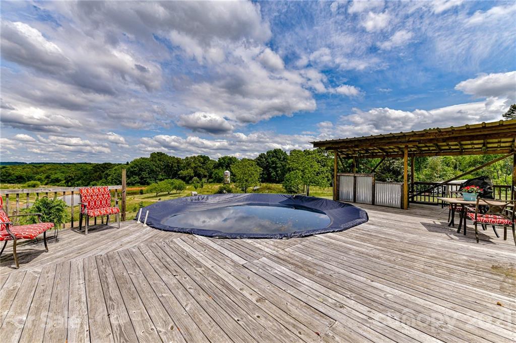 350 Curlee Road Polkton, NC 28135 - Photo 35 of 44 a view of a terrace with a yard