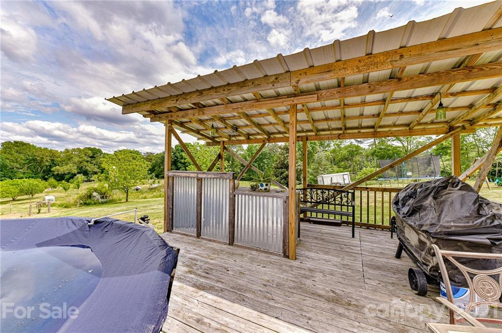 350 Curlee Road Polkton, NC 28135 - Photo 36 of 44 a backyard of a house with table and chairs