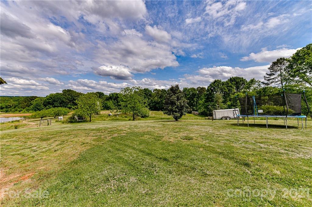 350 Curlee Road Polkton, NC 28135 - Photo 39 of 44 a swimming pool with wooden fence
