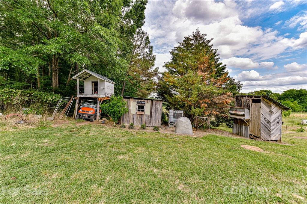 350 Curlee Road Polkton, NC 28135 - Photo 44 of 44 a view of a house with a yard and sitting area