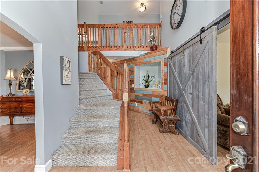 350 Curlee Road Polkton, NC 28135 - Photo 6 of 44 a view of entryway and hall with wooden floor