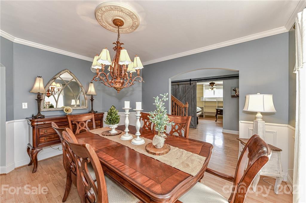 350 Curlee Road Polkton, NC 28135 - Photo 9 of 44 a view of a dining room with furniture and chandelier