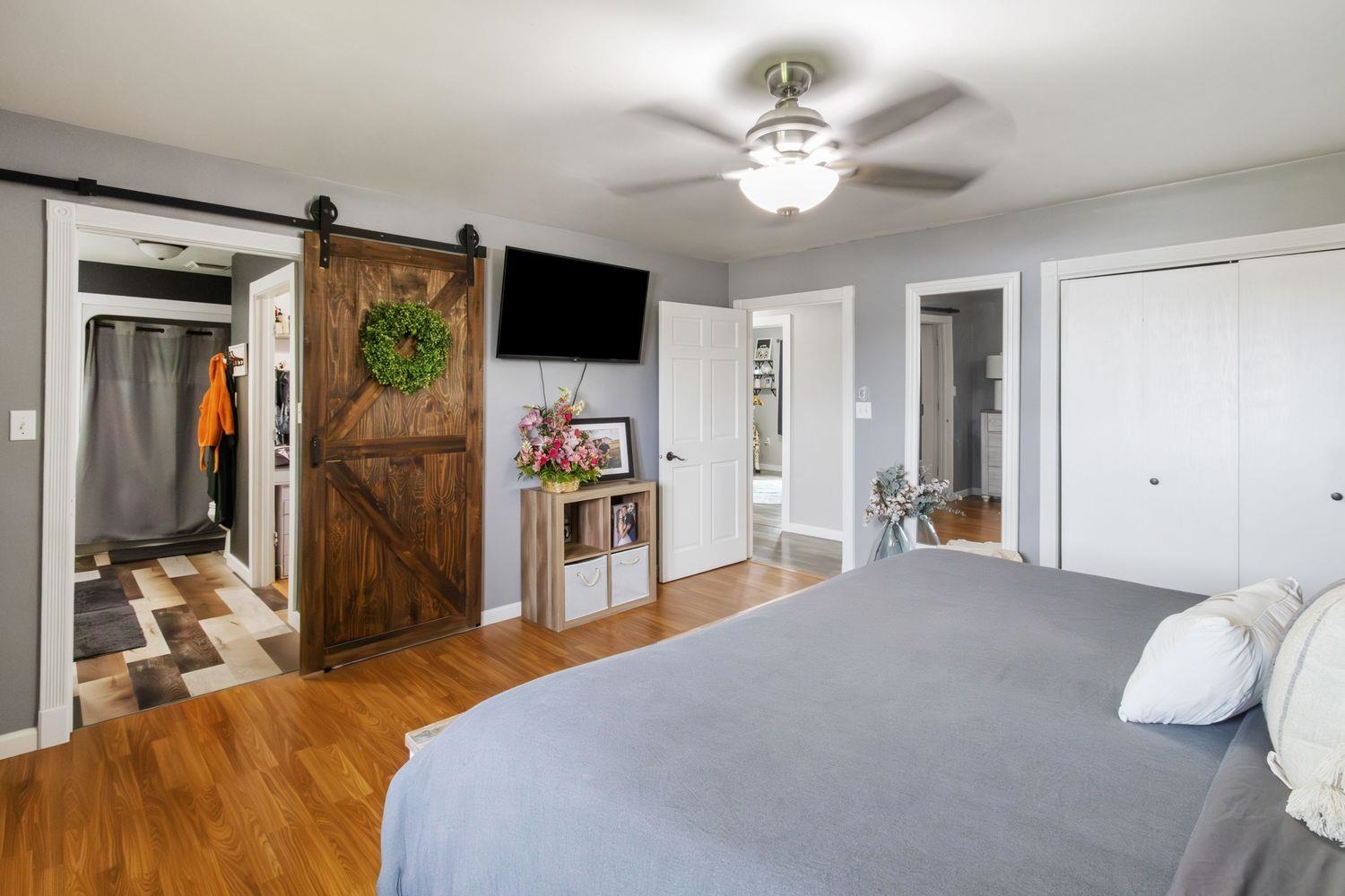 29124 Plautz Road Rock Falls, IL 61071 - Photo 20 of 45 a bedroom with a bed and a flat screen tv