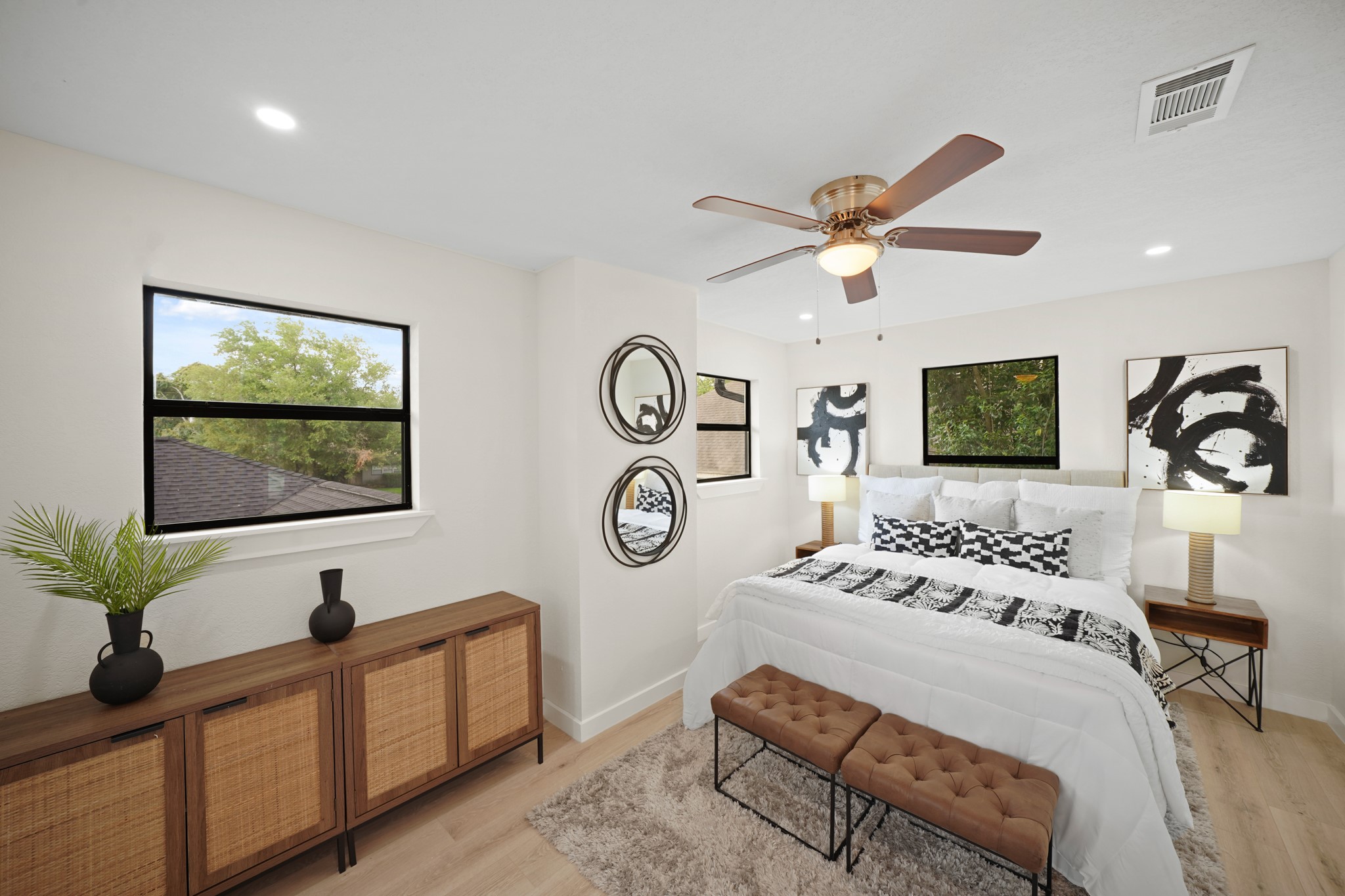 4813 Hummingbird Street Houston, TX 77035 - Photo 29 of 50 The Fifth Bedroom offers a Contemporary Style Ceiling Fan with Polished Nickel Accent and Light, LED Flush Mounts, and a Window that views the Upstairs Deck and Mature Trees.
