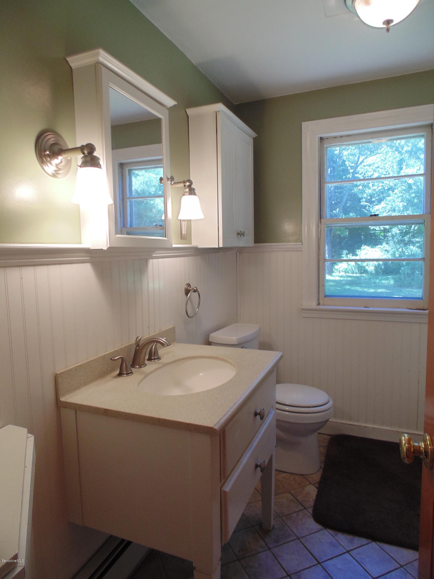 390 Montgomery Road Westfield, MA 01085 - Photo 11 of 29 a bathroom with a sink toilet and a mirror