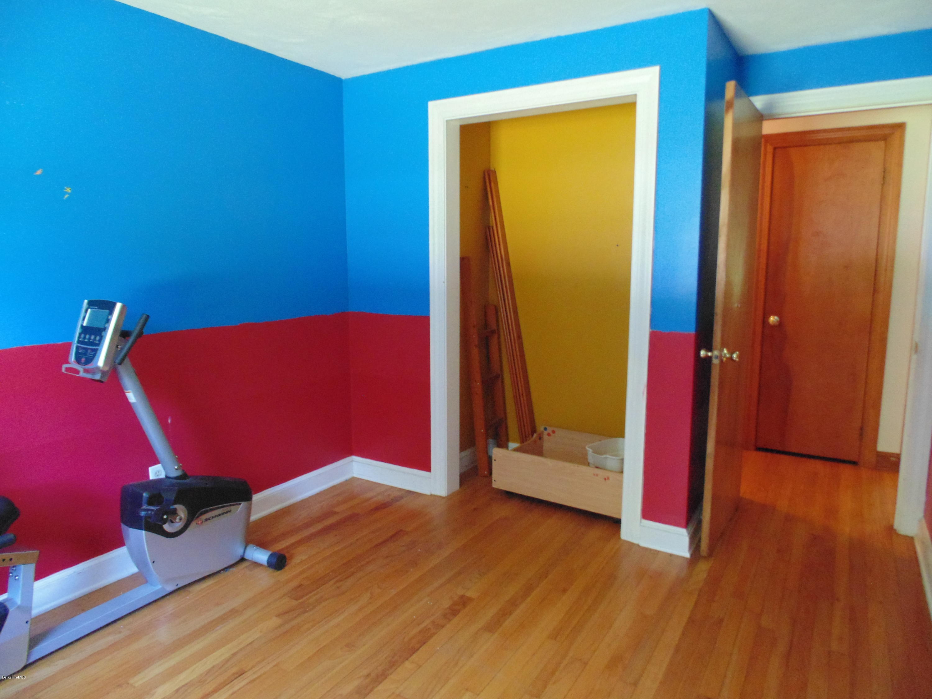 390 Montgomery Road Westfield, MA 01085 - Photo 13 of 29 an empty room with wooden floor and closet