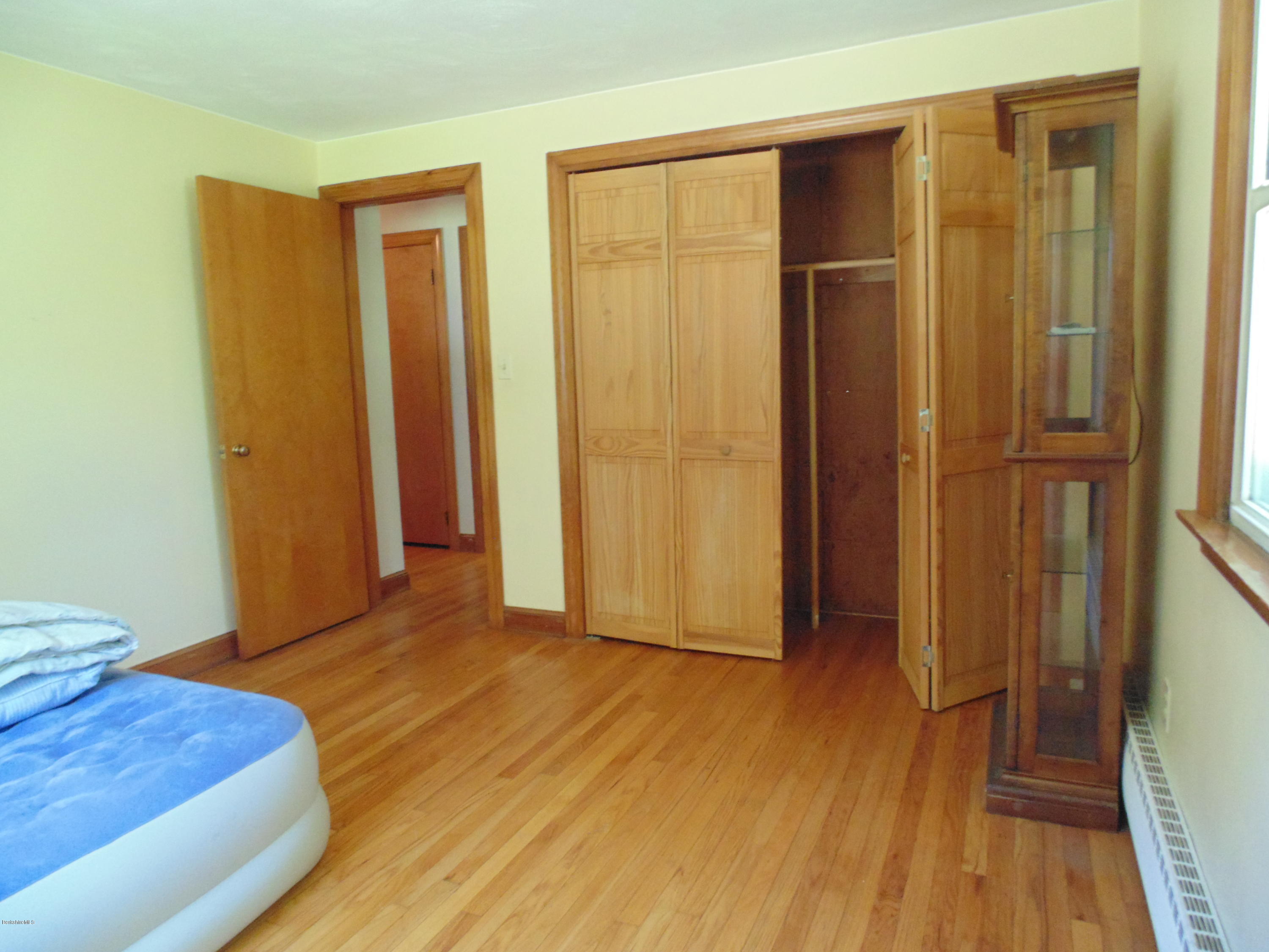 390 Montgomery Road Westfield, MA 01085 - Photo 15 of 29 a view of livingroom with hardwood floor and hallway