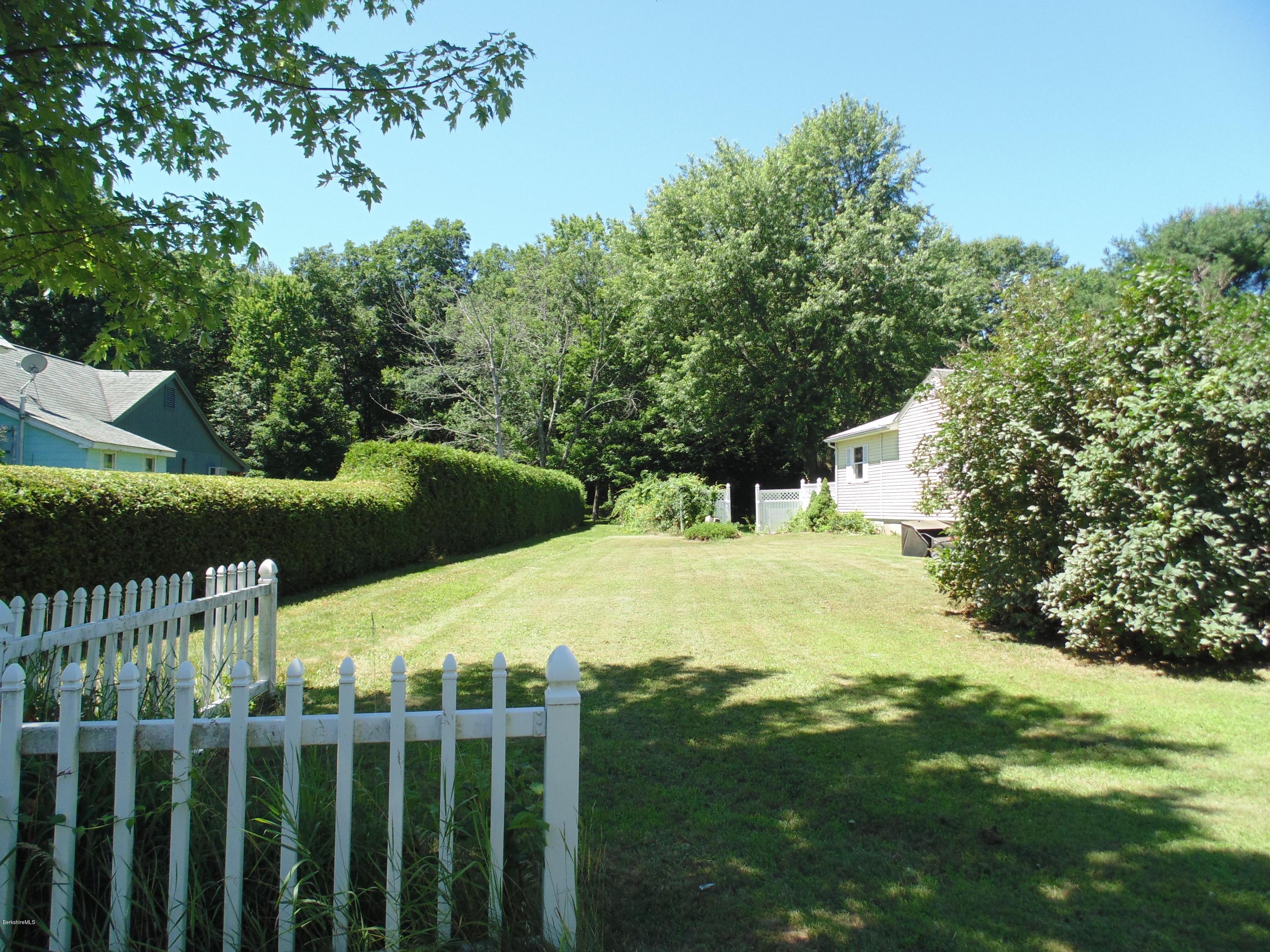 390 Montgomery Road Westfield, MA 01085 - Photo 29 of 29 a view of a yard with plants and large trees