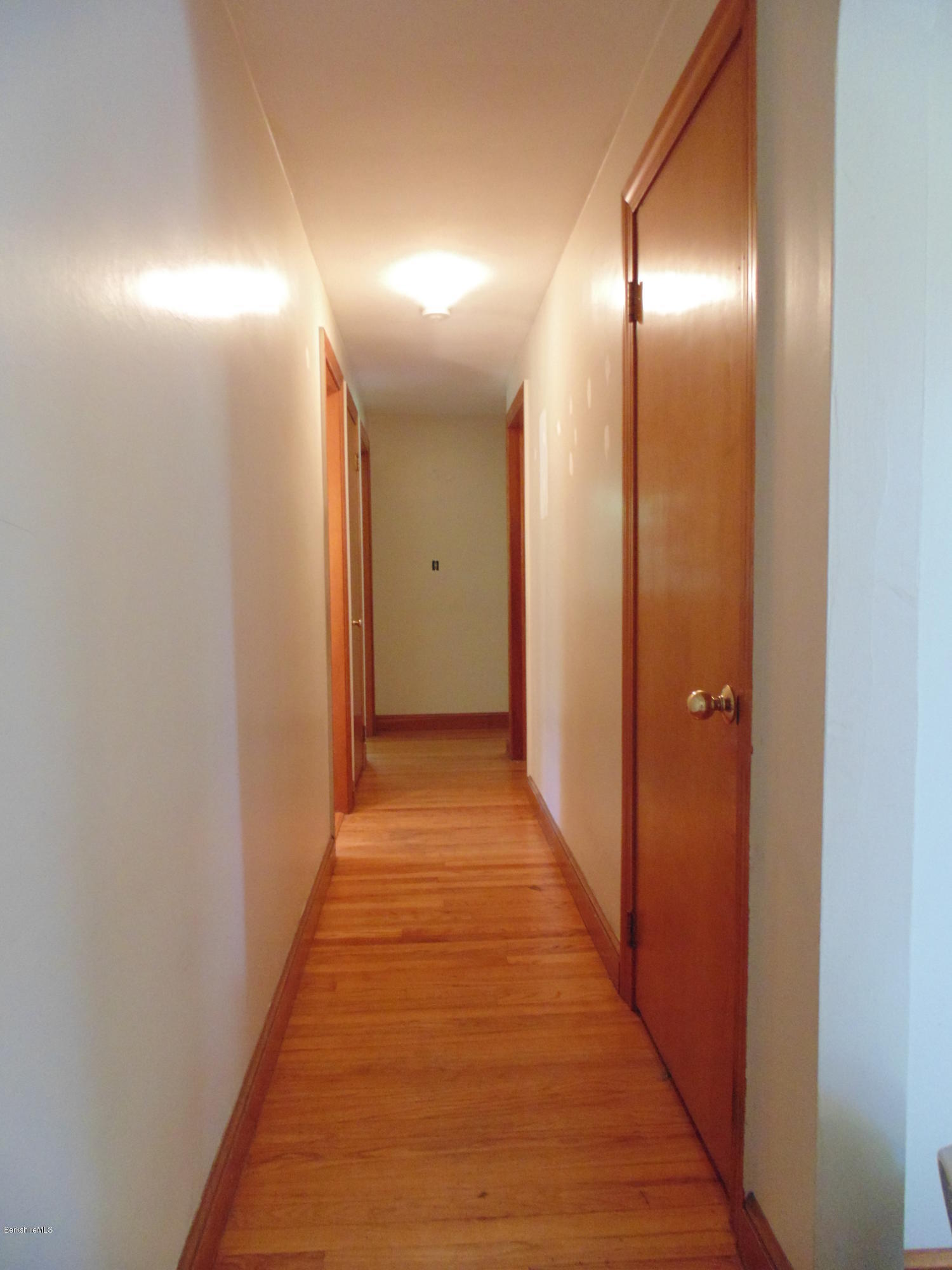 390 Montgomery Road Westfield, MA 01085 - Photo 10 of 29 a view of hallway with wooden floor
