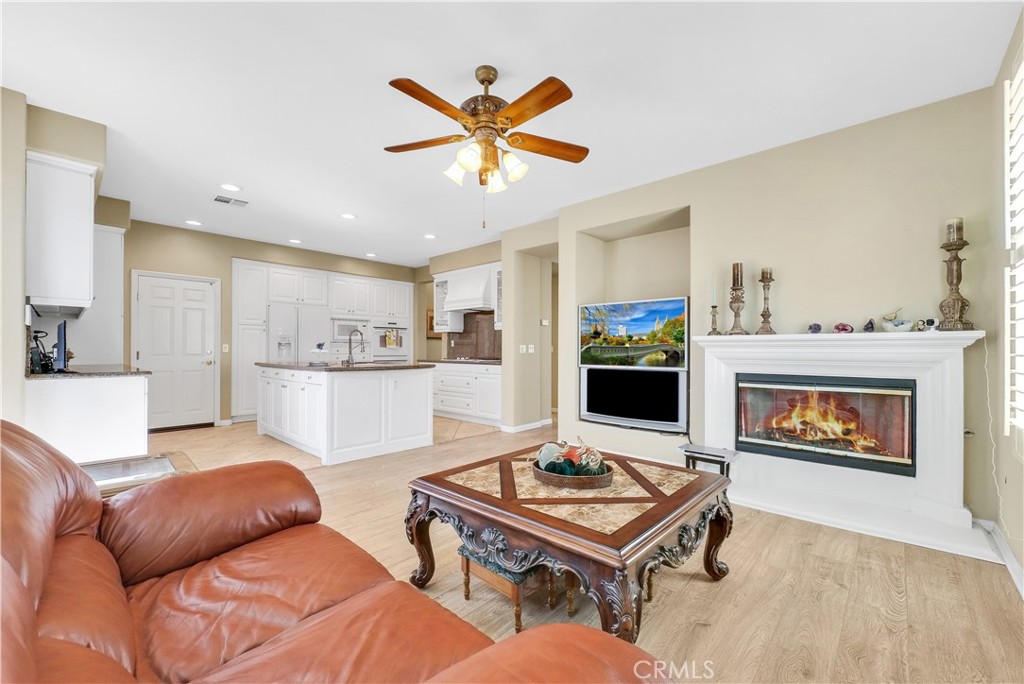 2094 Ward Street Fullerton, CA 92833 - Photo 21 of 66 a living room with furniture a flat screen tv and a fireplace