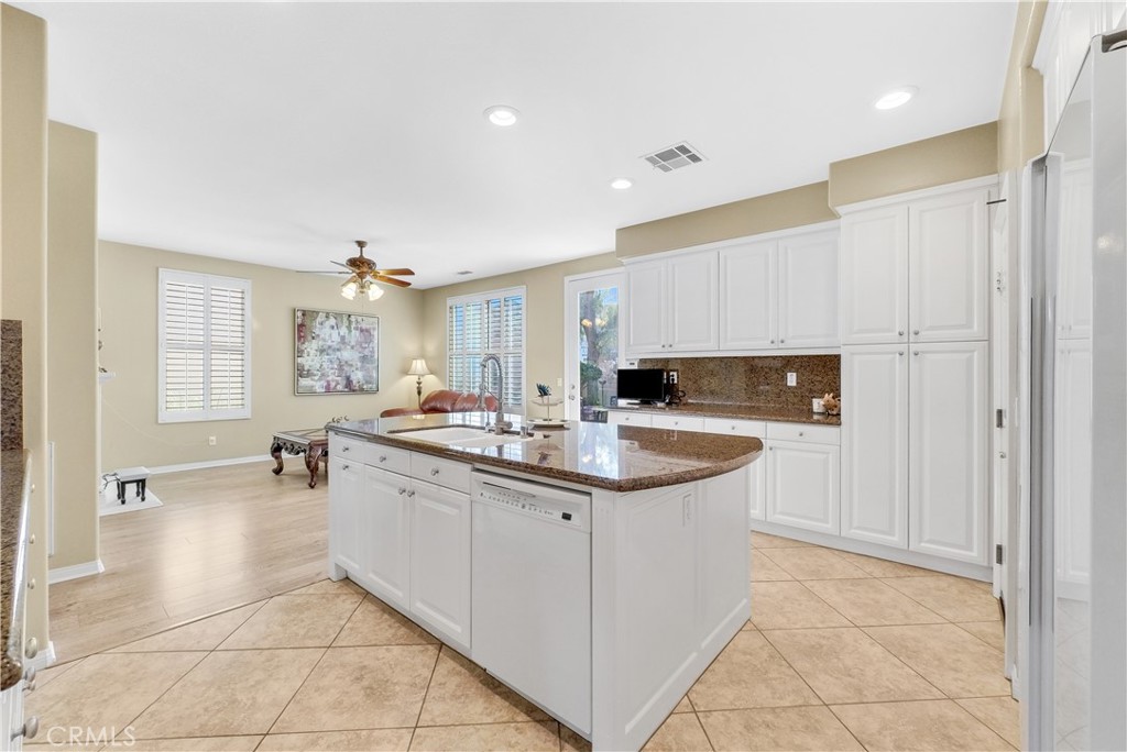 2094 Ward Street Fullerton, CA 92833 - Photo 24 of 66 a kitchen with stainless steel appliances granite countertop a sink and cabinets