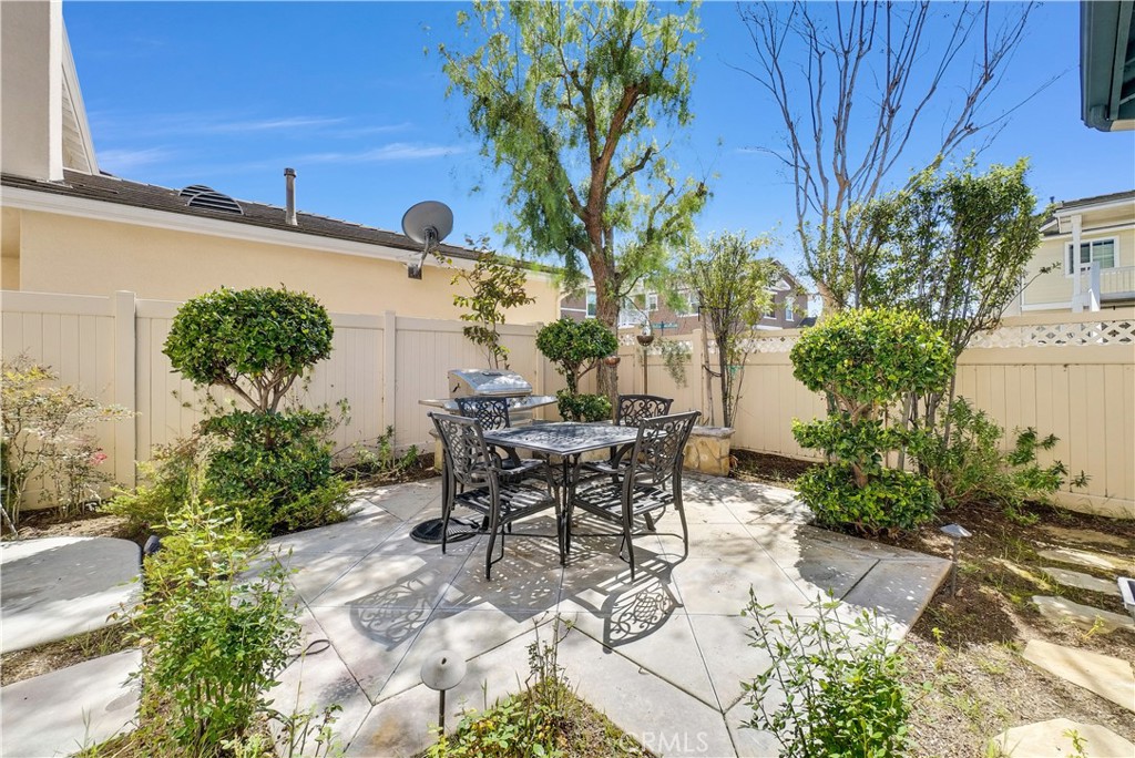 2094 Ward Street Fullerton, CA 92833 - Photo 27 of 66 a view of a patio with table and chairs and potted plants