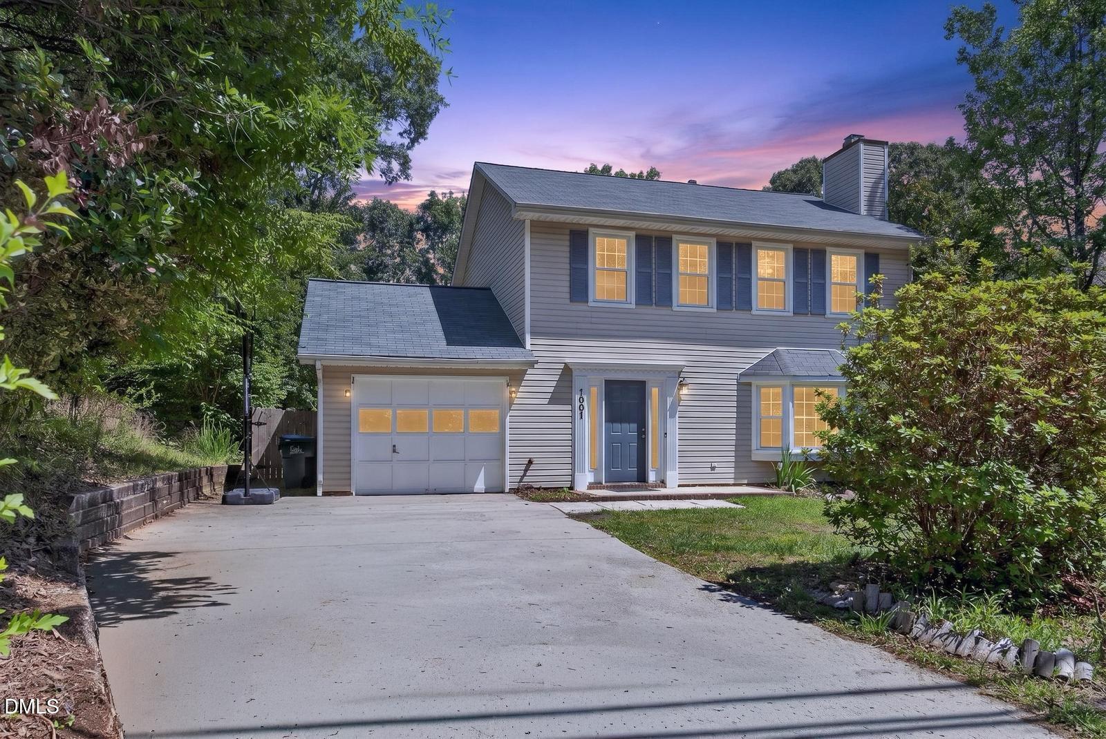 1901 Whites Mill Road High Point, NC 27265 - Photo 2 of 24 a front view of a house with a yard and garage