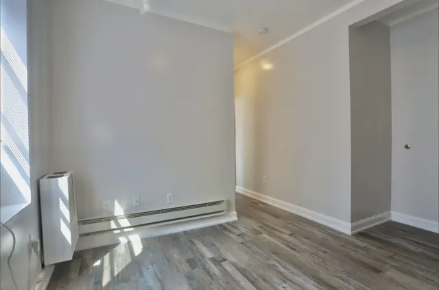 a bathroom with a toilet a sink and shower