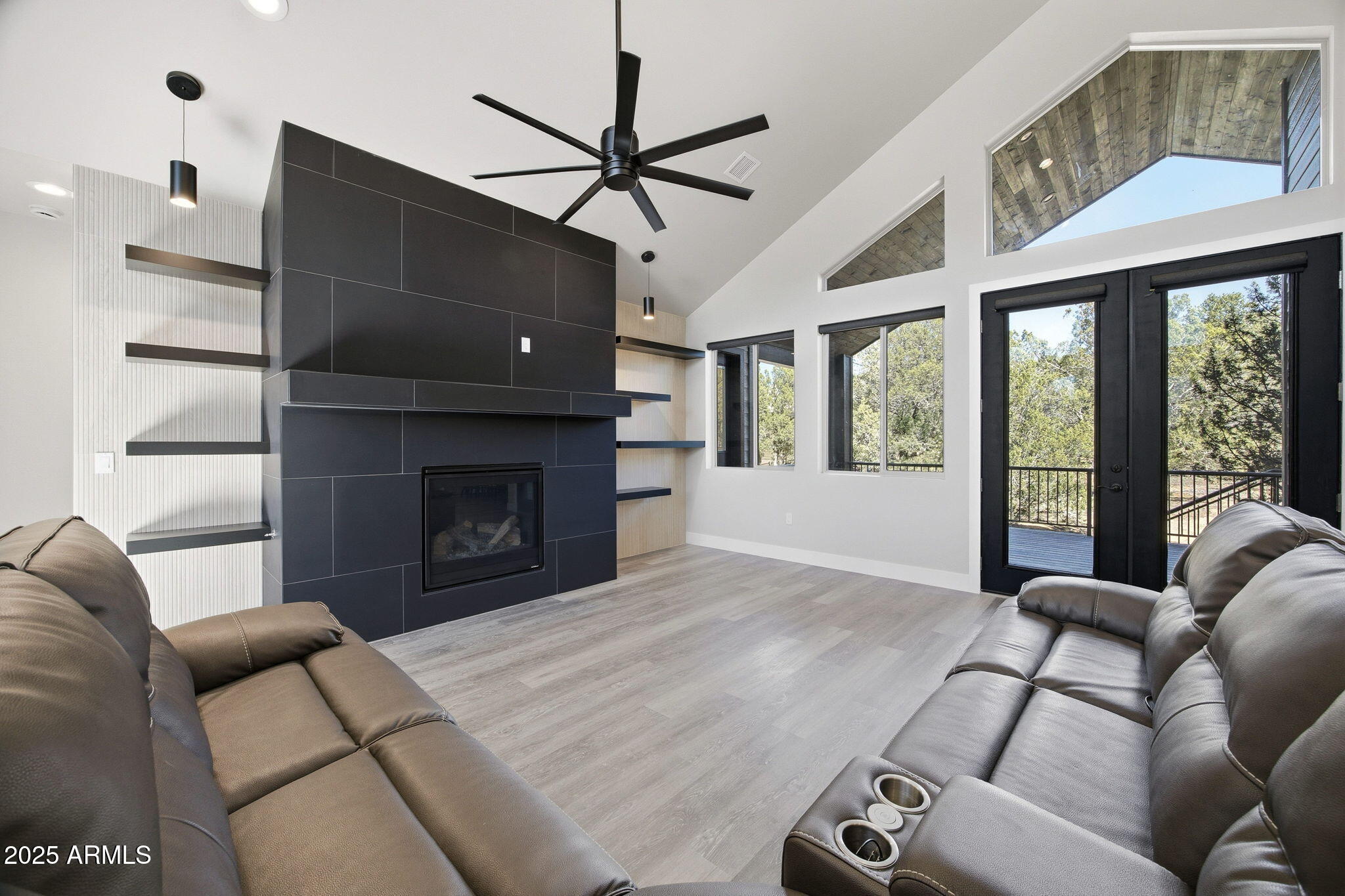 2701 North Eagle View Circle Show Low, AZ 85901 - Photo 1 of 49 a living room with furniture a flat screen tv and a fireplace