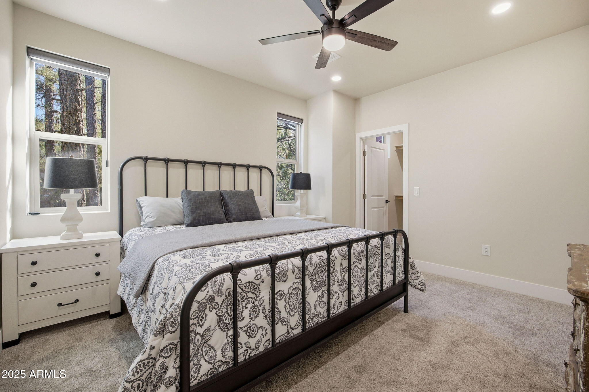 2701 North Eagle View Circle Show Low, AZ 85901 - Photo 19 of 49 a bed room with a bed and a window