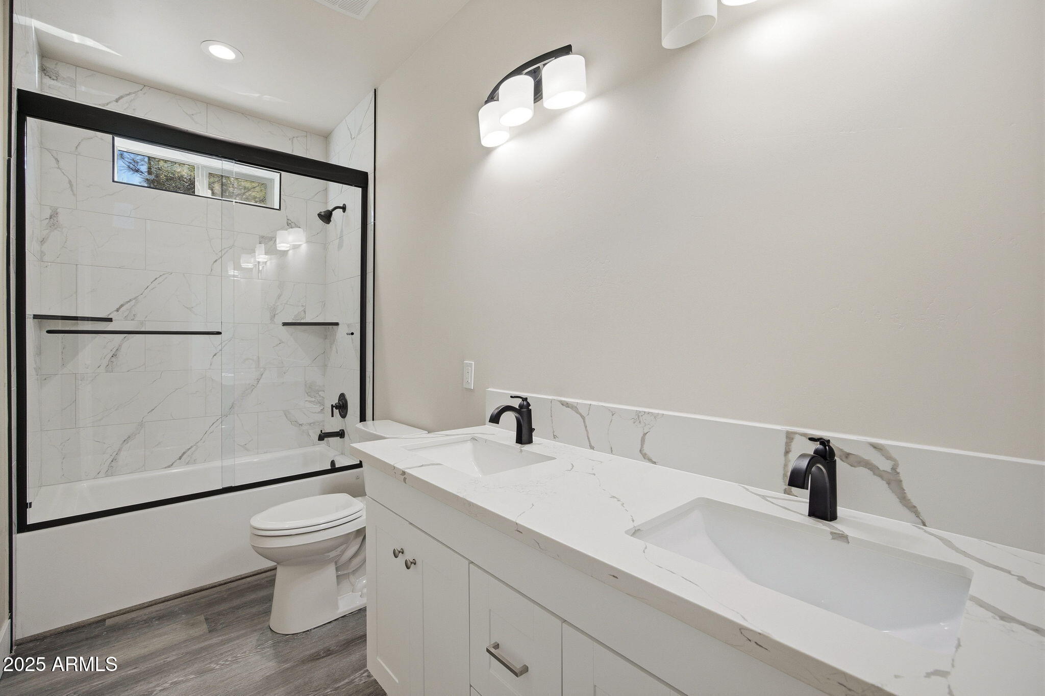 2701 North Eagle View Circle Show Low, AZ 85901 - Photo 21 of 49 a bathroom with a sink a toilet and a large mirror