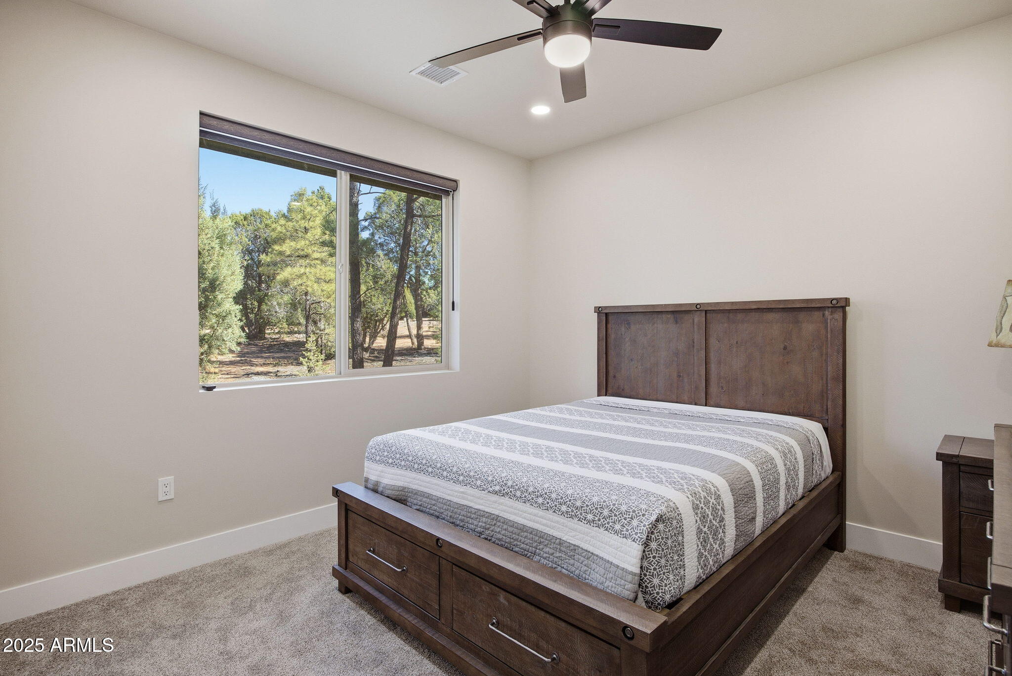 2701 North Eagle View Circle Show Low, AZ 85901 - Photo 22 of 49 a bedroom with a bed and a window