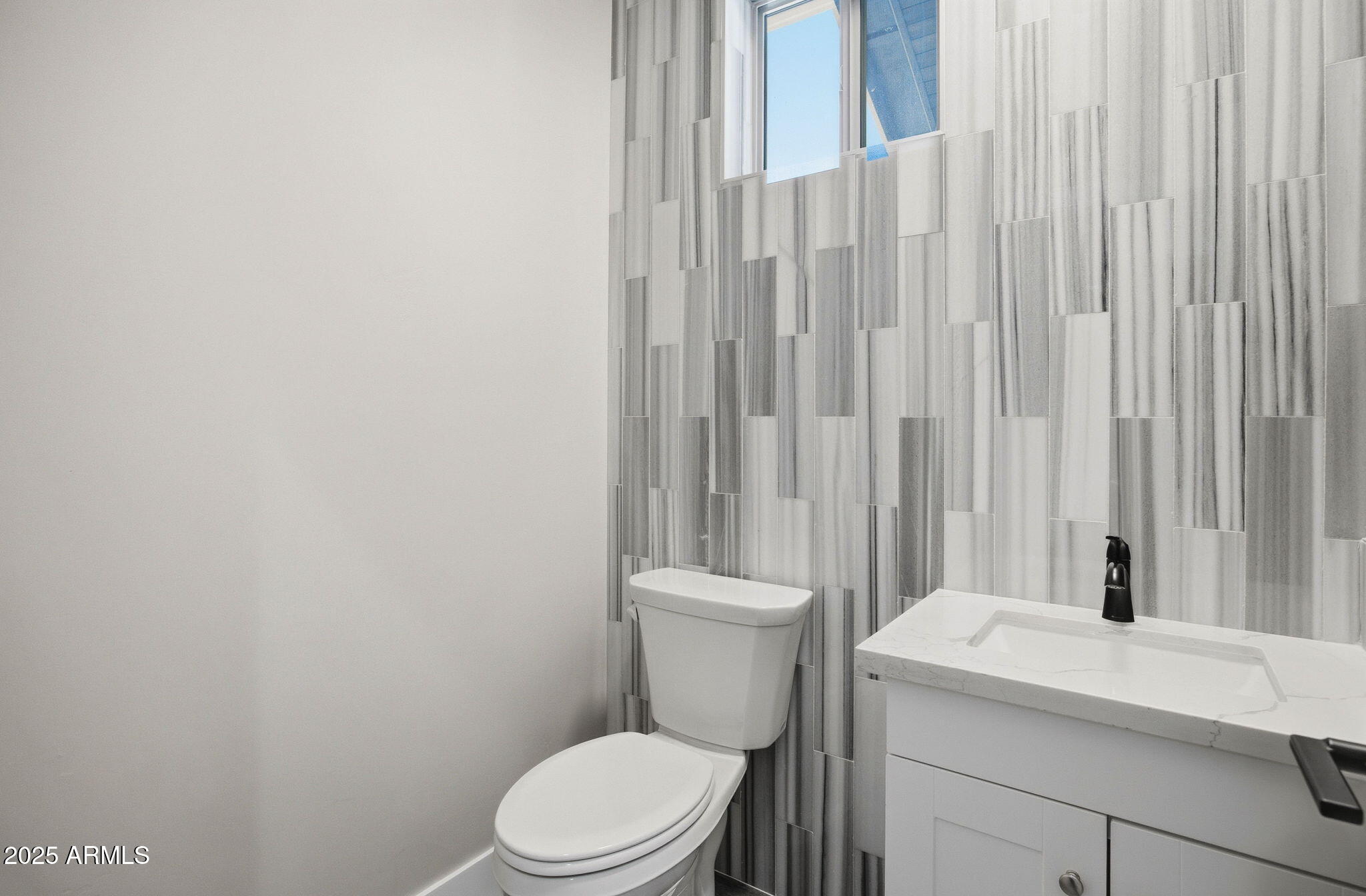 2701 North Eagle View Circle Show Low, AZ 85901 - Photo 24 of 49 a white toilet sitting next to a white sink