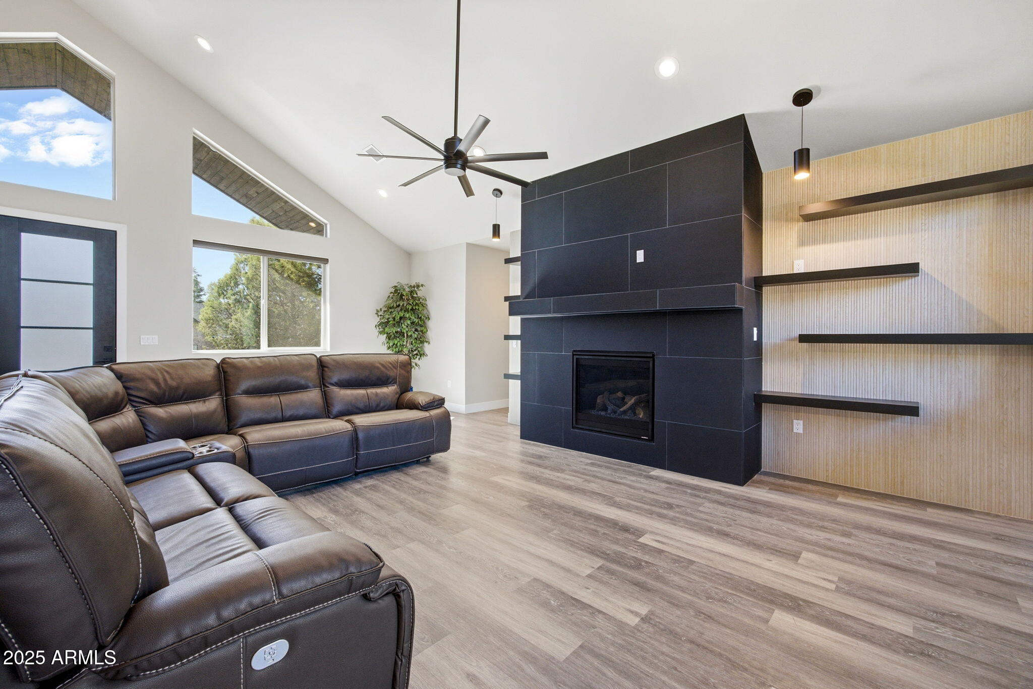 2701 North Eagle View Circle Show Low, AZ 85901 - Photo 2 of 49 a living room with furniture and a fireplace