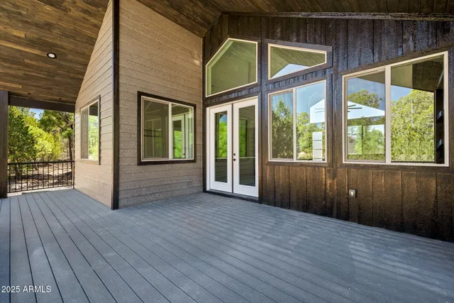 a view of balcony with wooden floor