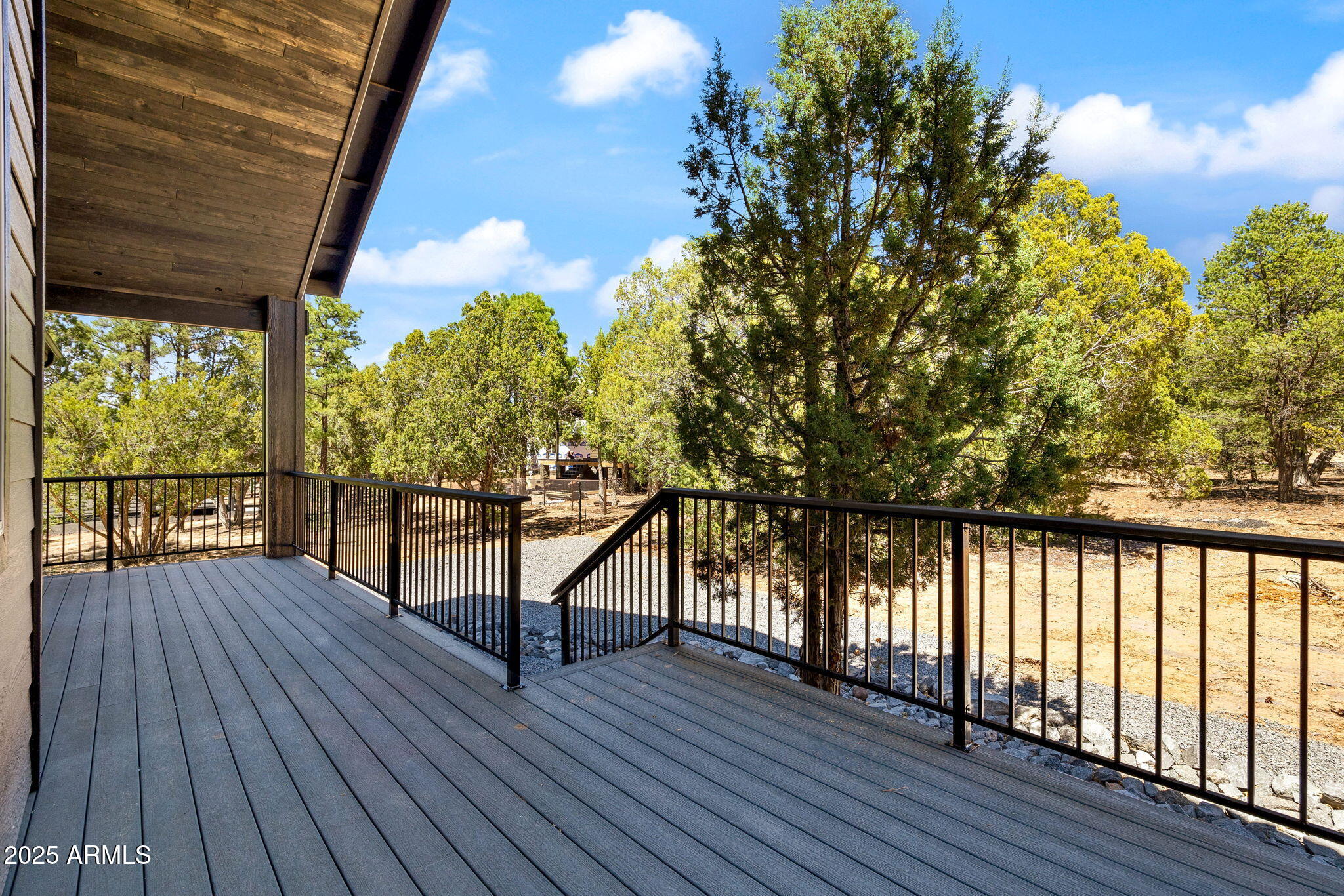 2701 North Eagle View Circle Show Low, AZ 85901 - Photo 41 of 49 a view of balcony with wooden floor and fence