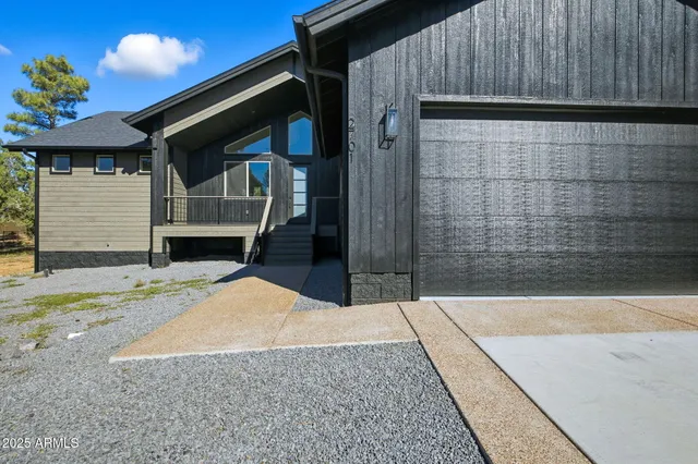 a front view of a house with a garage