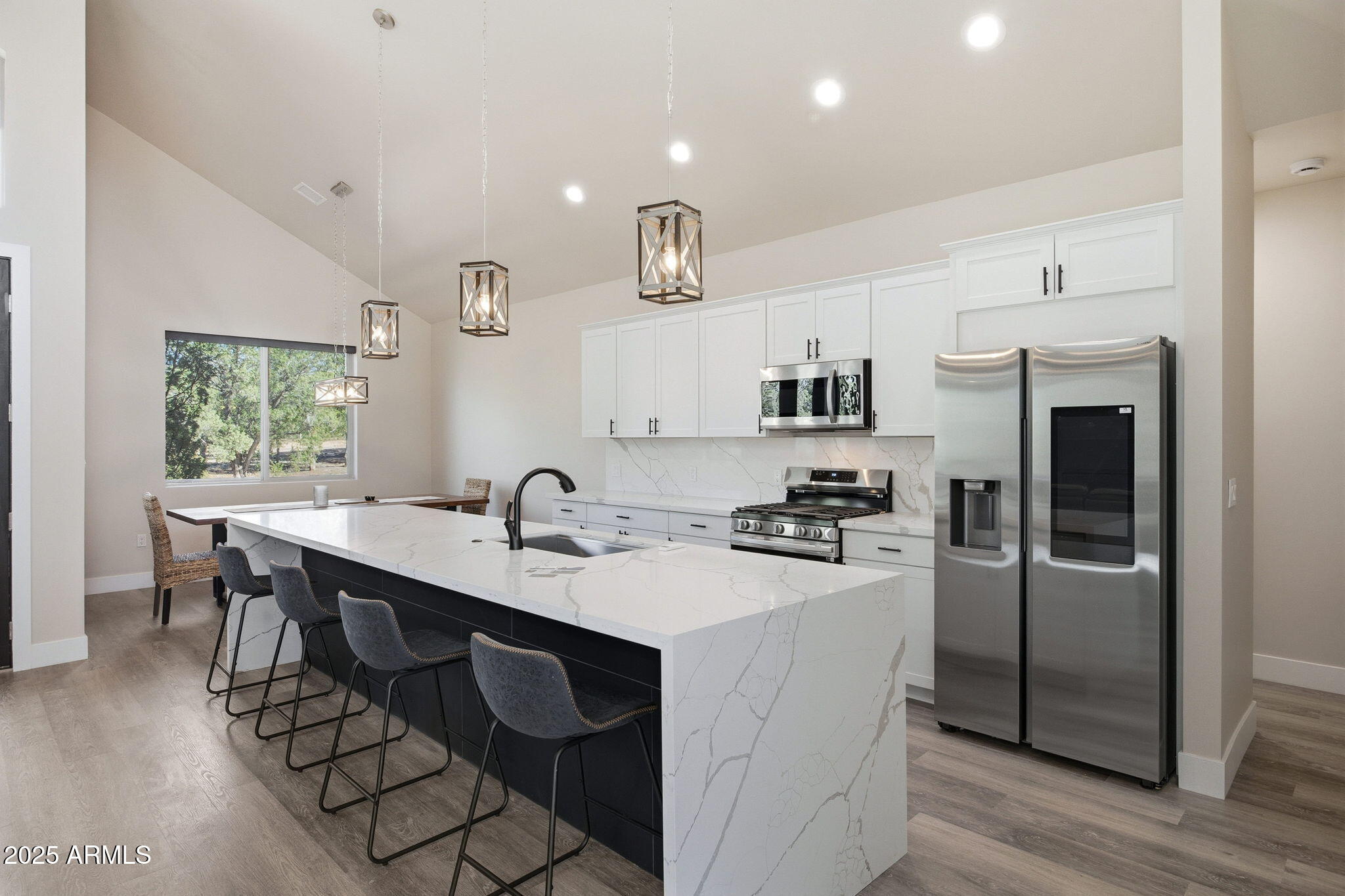 2701 North Eagle View Circle Show Low, AZ 85901 - Photo 8 of 49 a kitchen with granite countertop a sink appliances and cabinets