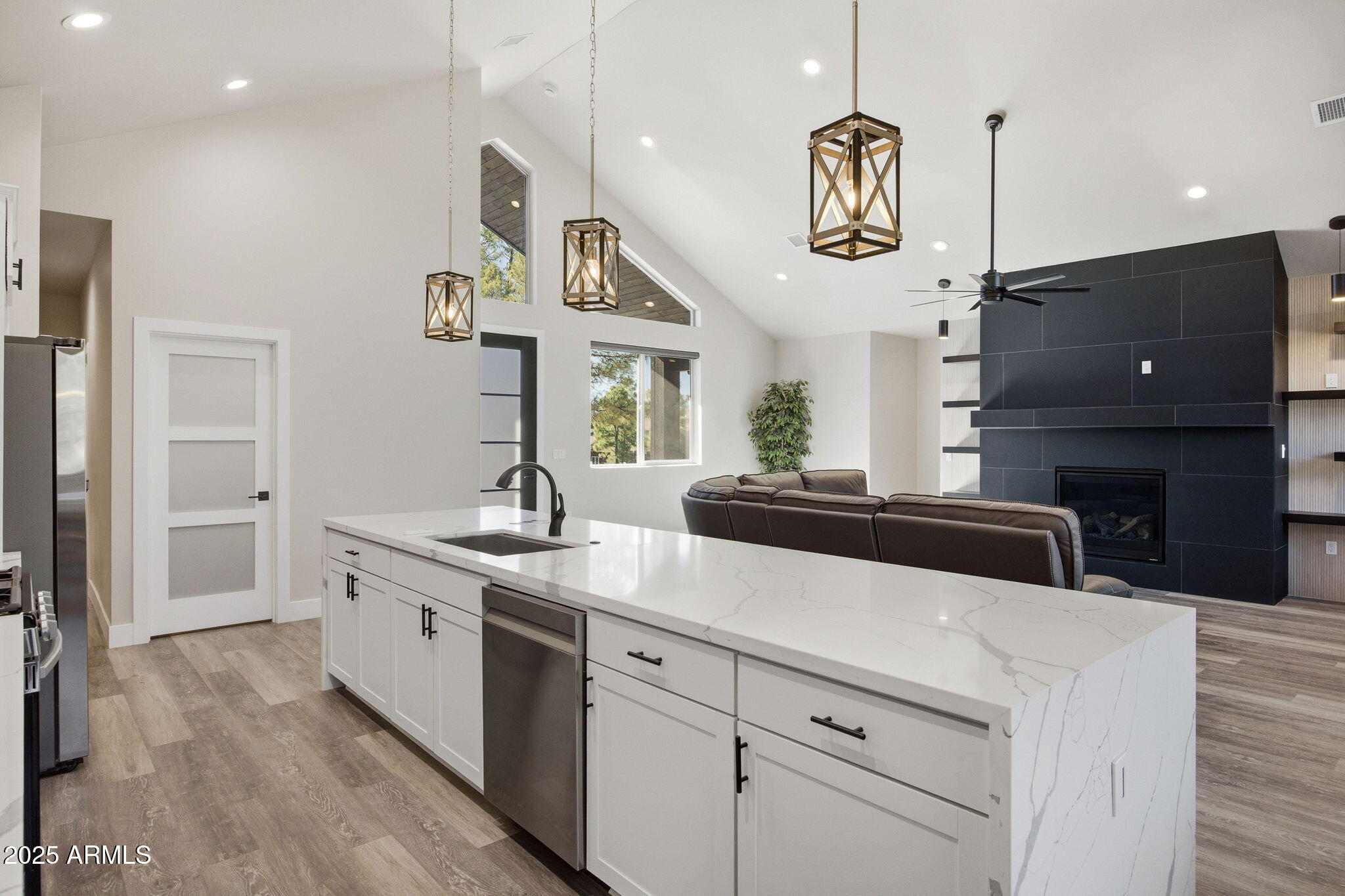 2701 North Eagle View Circle Show Low, AZ 85901 - Photo 9 of 49 a kitchen with kitchen island granite countertop stainless steel appliances and wooden floor