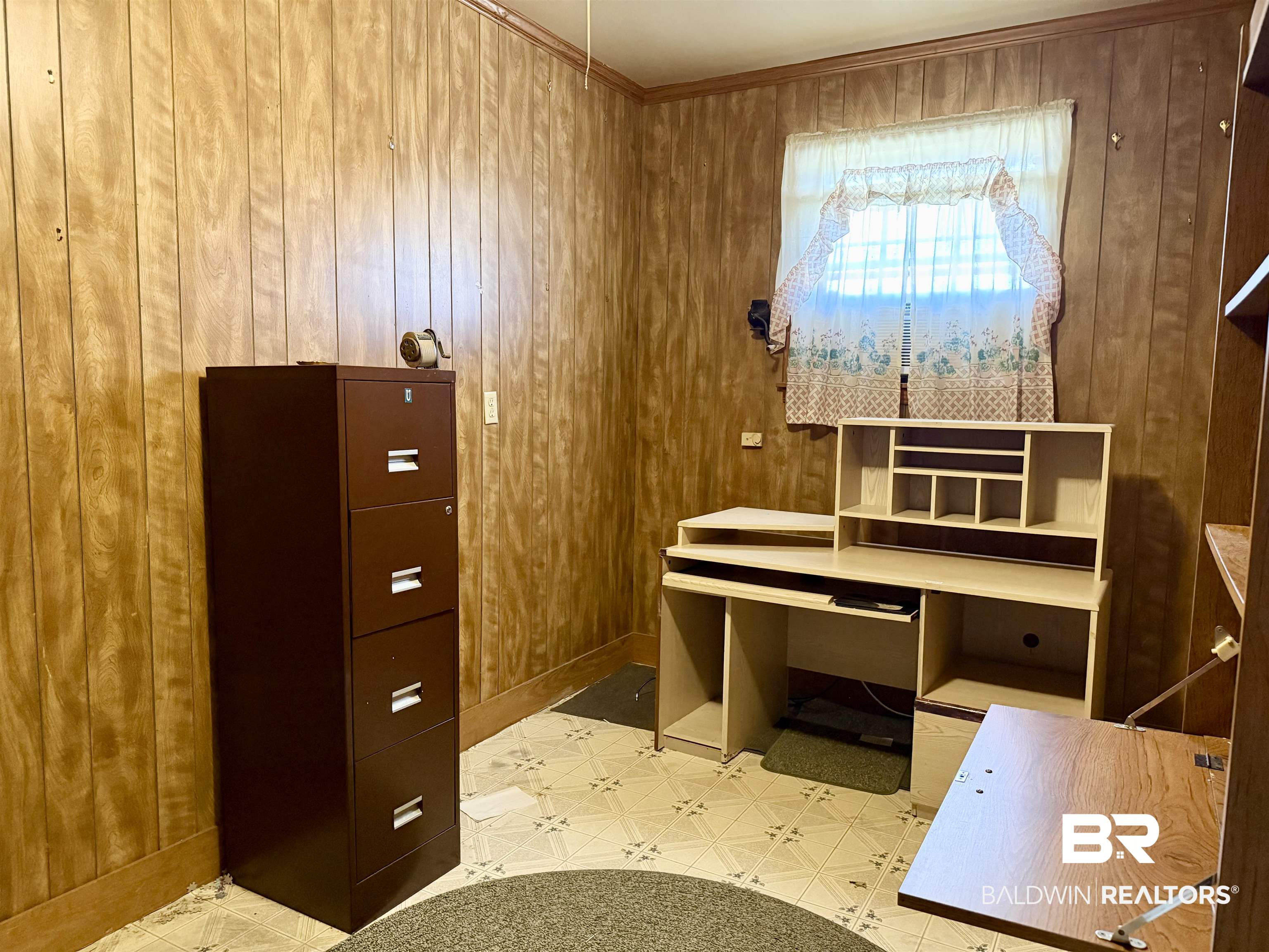98 Evans Avenue Brewton, AL 36426 - Photo 12 of 18 Office featuring light floors and wooden walls