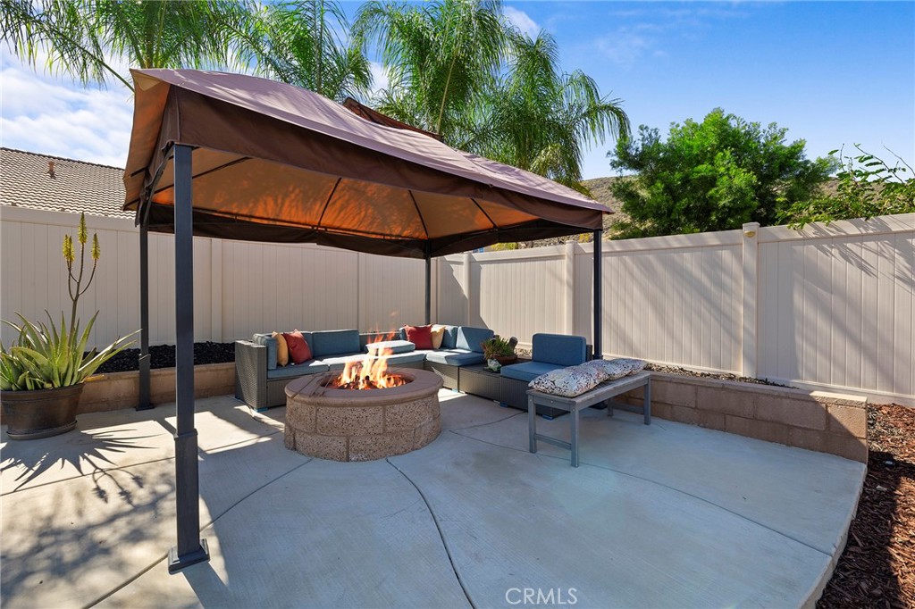 33185 Big Range Drive Winchester, CA 92596 - Photo 45 of 54 a backyard of a house with outdoor seating