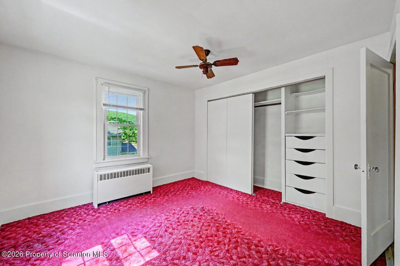502 Layton Road Clarks Summit, PA 18411 - Photo 24 of 42 a bedroom with a bed and a dresser