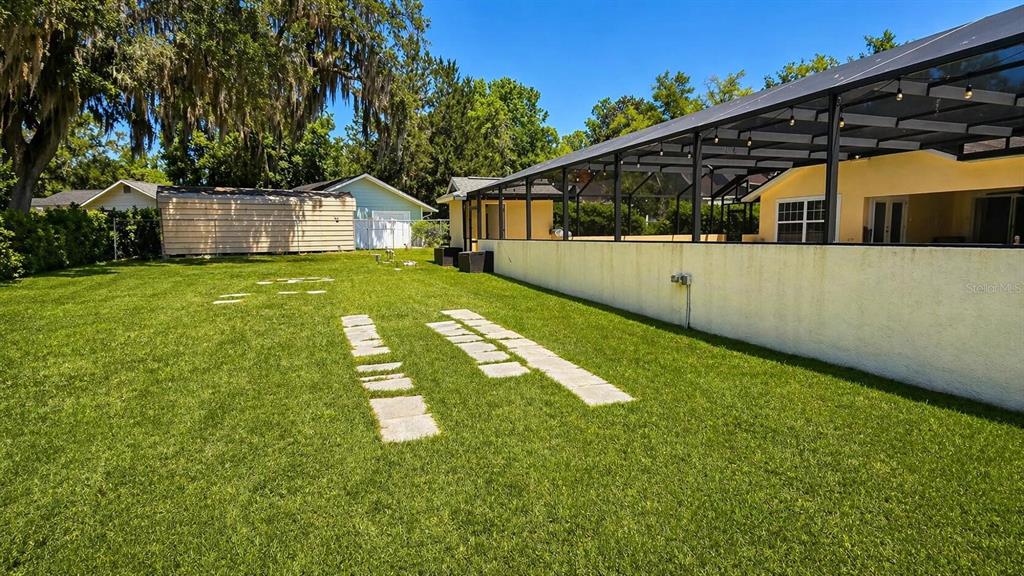2313 Southeast 7th Street Ocala, FL 34471 - Photo 49 of 54 a front view of house with yard and green space