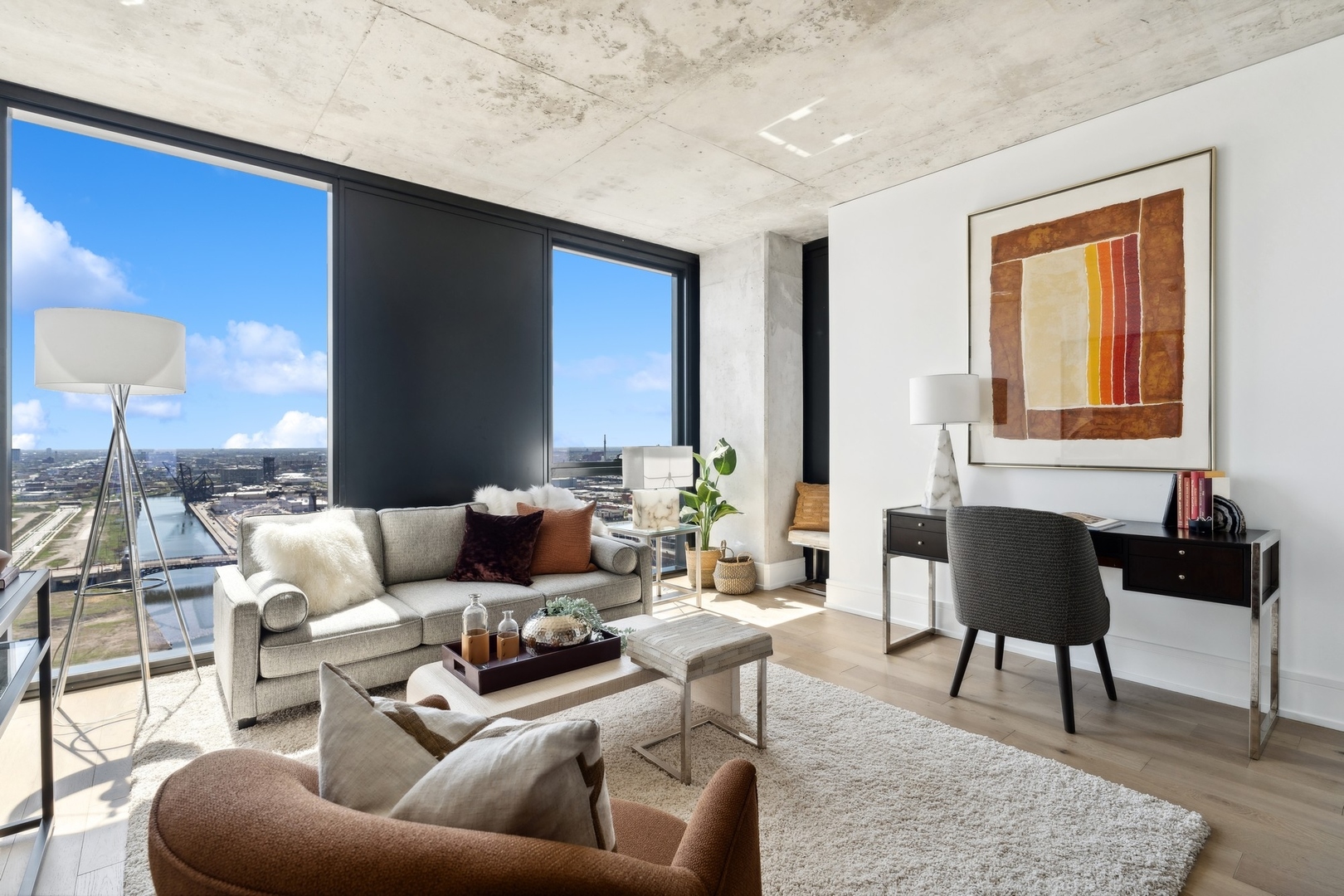 234 West Polk Street, Unit 3307 Chicago, IL 60607 - Photo 4 of 31 a living room with furniture and a lamp