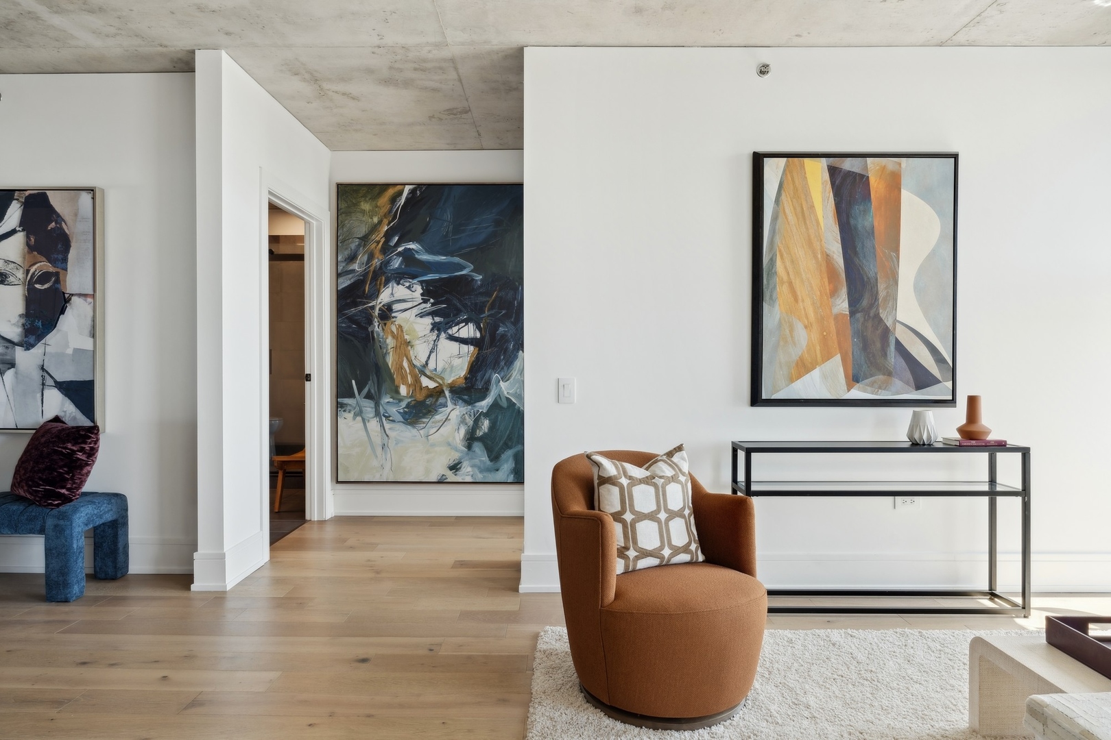 234 West Polk Street, Unit 3307 Chicago, IL 60607 - Photo 10 of 31 a living room with furniture and a painting on the wall